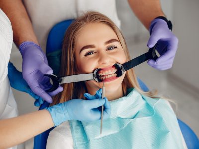 Beautiful lady in the dentist's office. Woman in a uniform